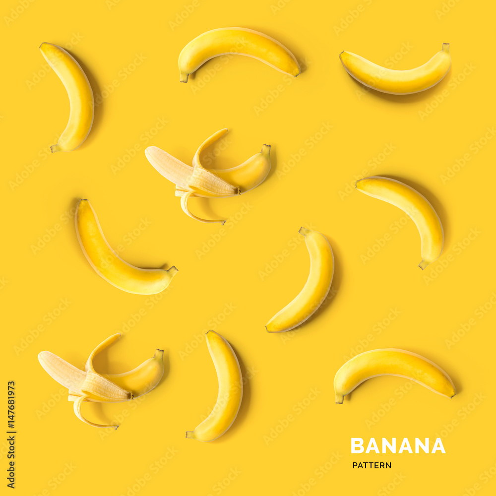 Seamless pattern with fruits. Tropical abstract background. Banana on yellow background.