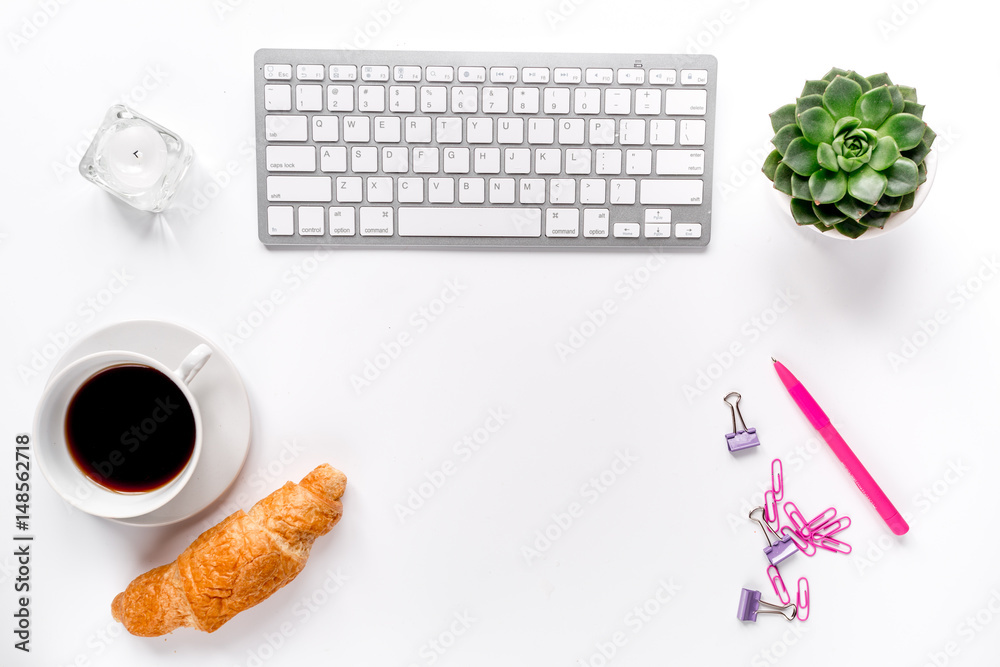 woman office desktop with coffee, croissant and keyboard white background top view mock-up