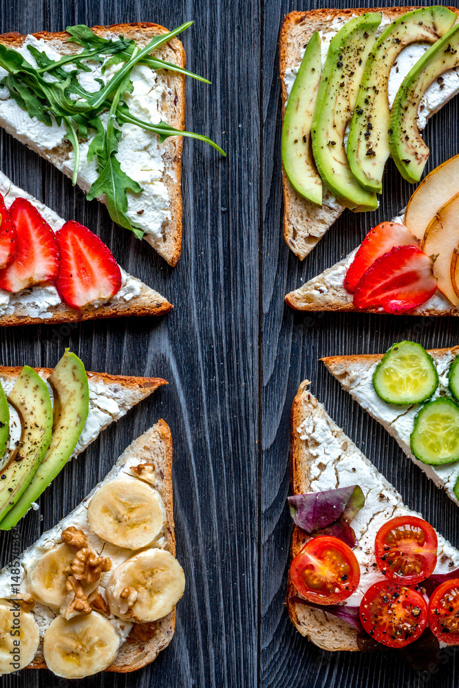 fitness breskfast with homemade sandwiches dark table background top view