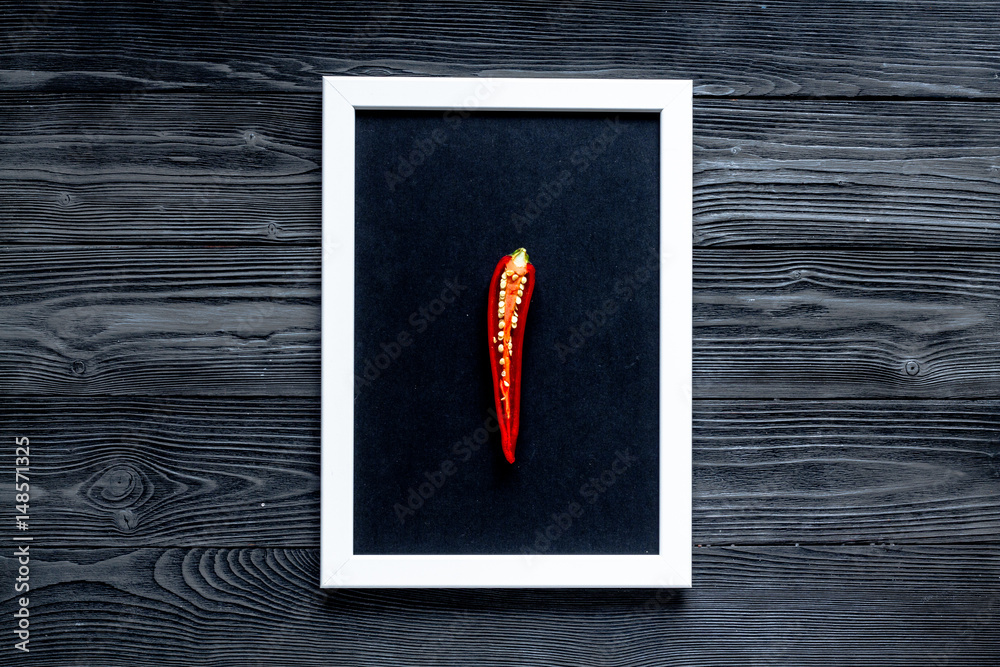 spicy food cooking with red chili frame wooden table background top view