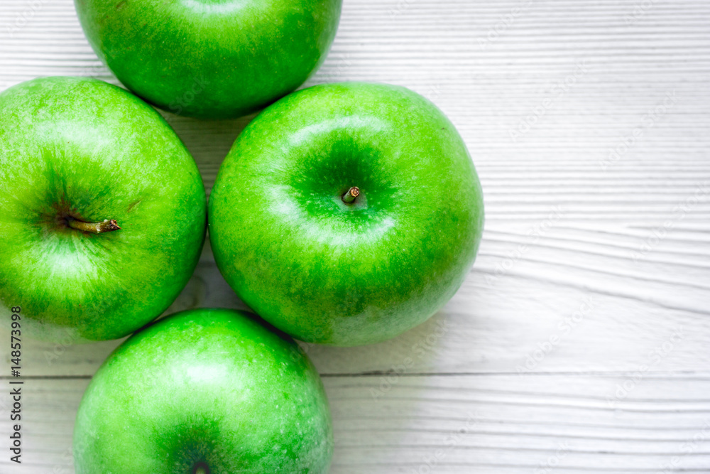 Healthy green food with apples on kitchen white background