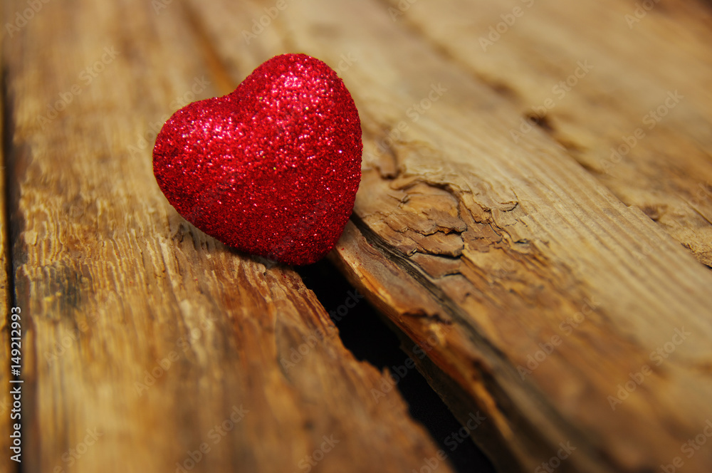 Red heart on wood