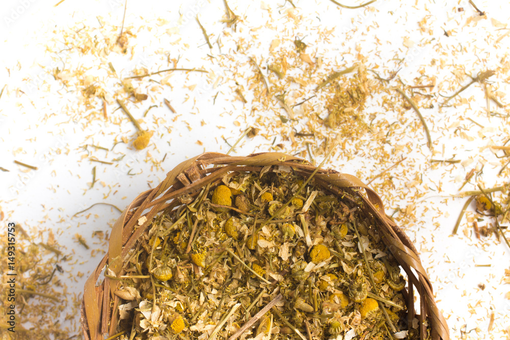 Dry chamomile into a basket