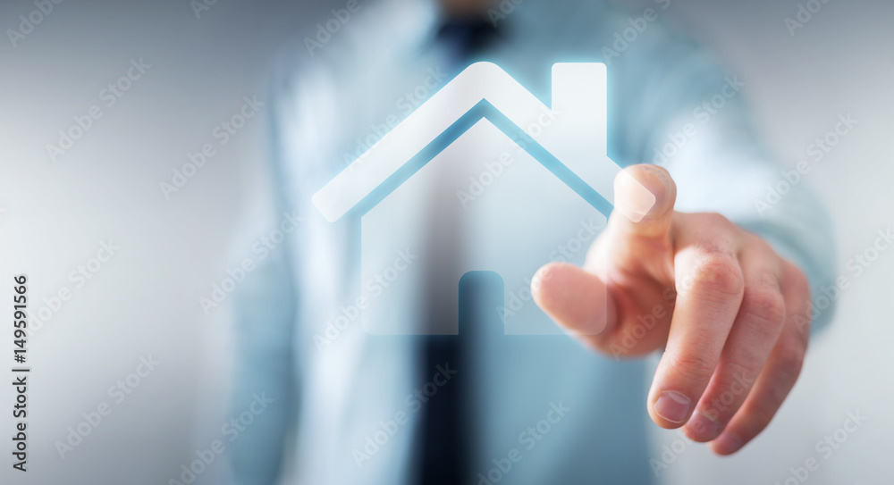 Businessman touching 3D rendering icon house with his finger