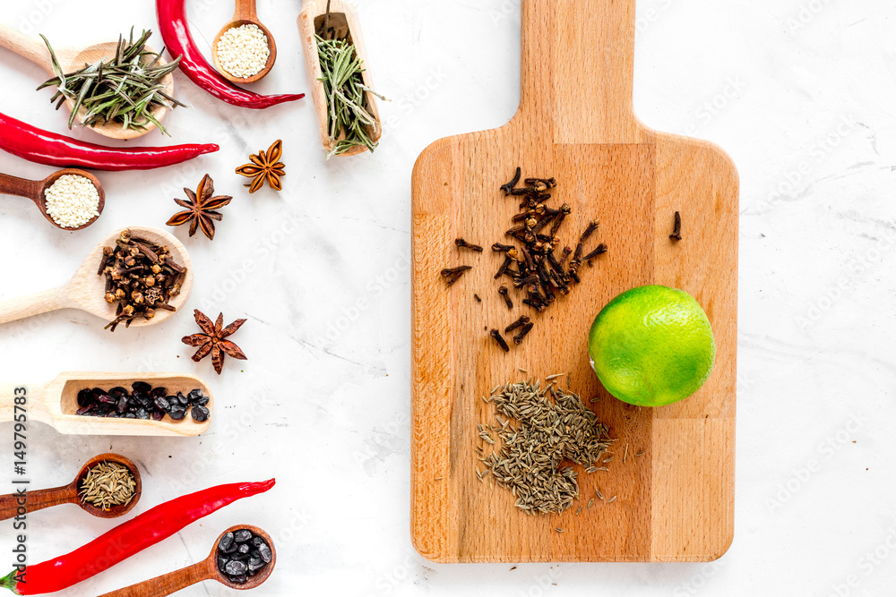 Cooking with spices, salt and pepper on kitchen table background top view