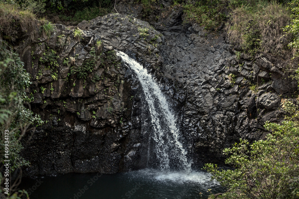 Water stream on rocky wall.