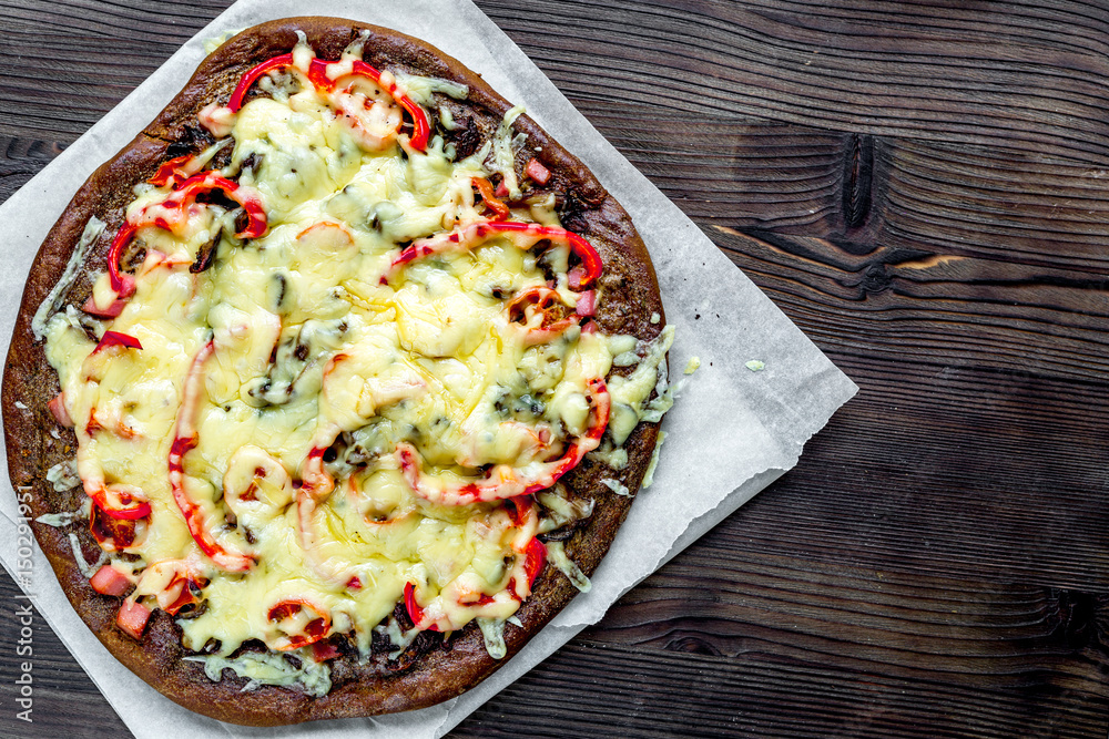 vegetarian pizza on wooden table background top view