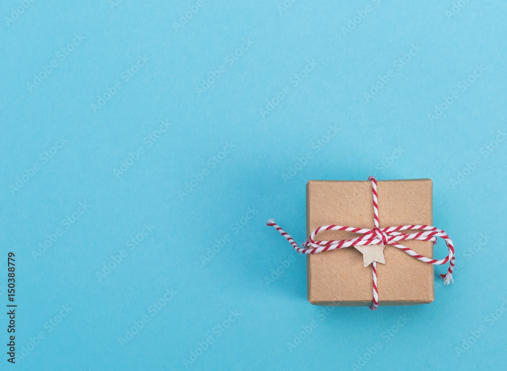 Little handmade gift box on a blue background