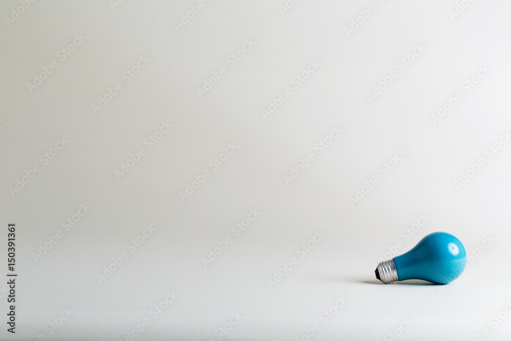 Colored lightbulb on a white background