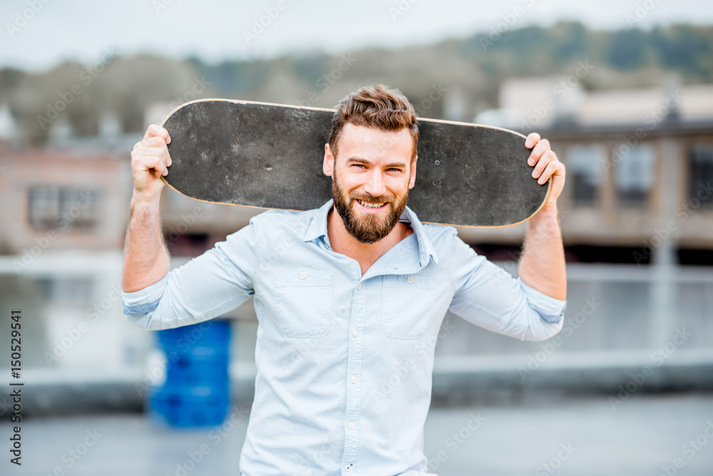 Businessman portrait with skateboard