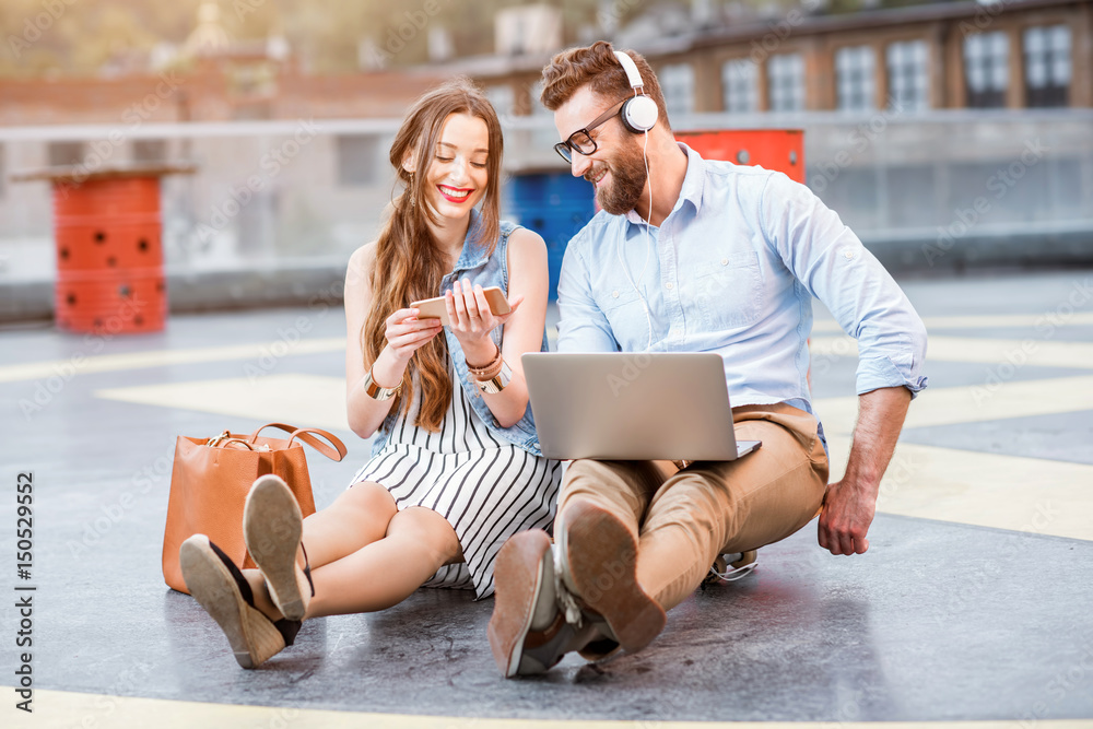 Business couple working outdoors on the heliport ground