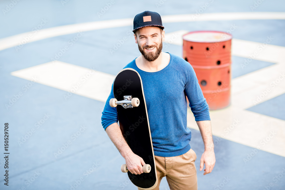 Portrait of a man with skateboard