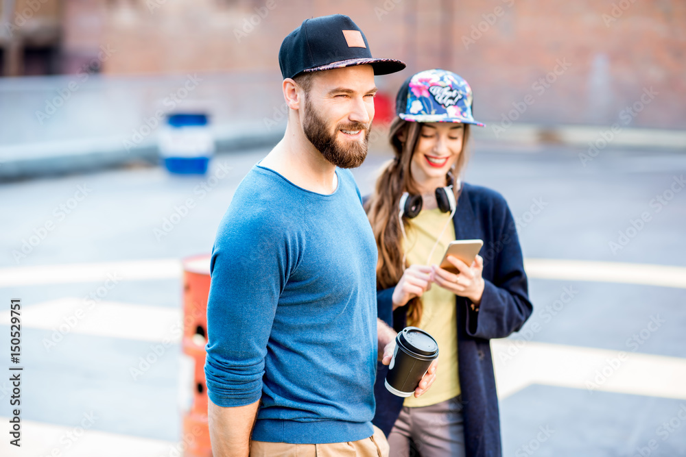 Portrait of a stylish man and woman outdoors