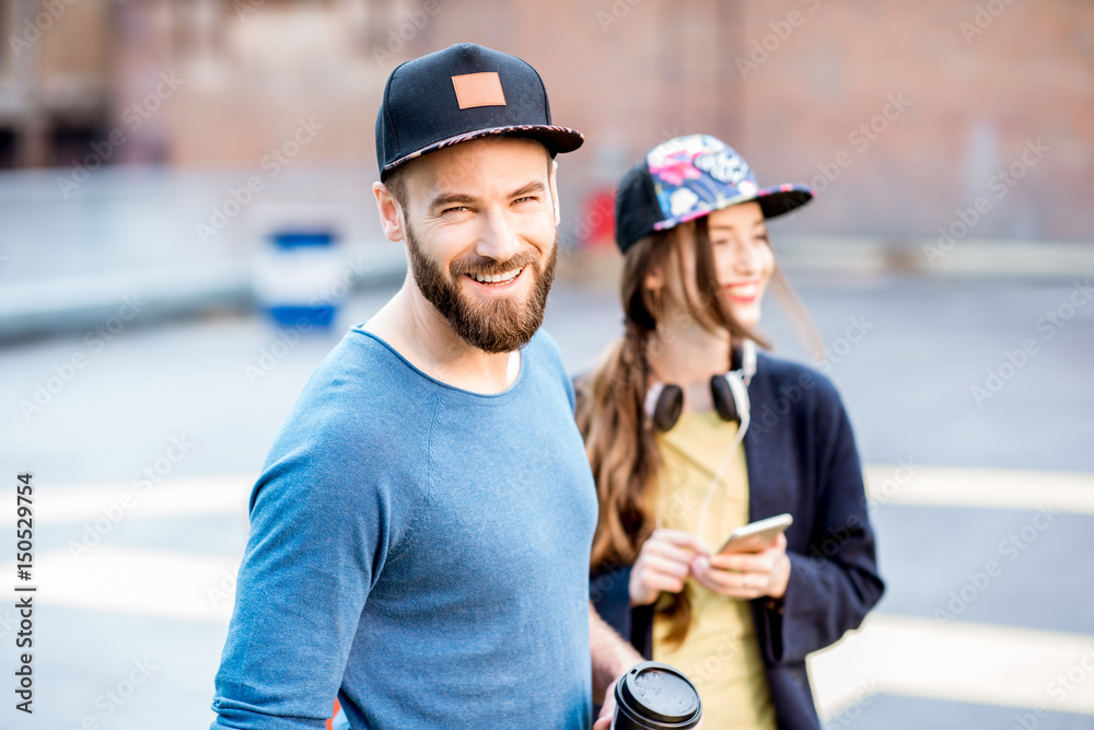 Portrait of a stylish man and woman outdoors