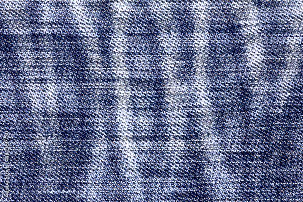 Close up the denim bright  blue jeans surface with rag patten texture background