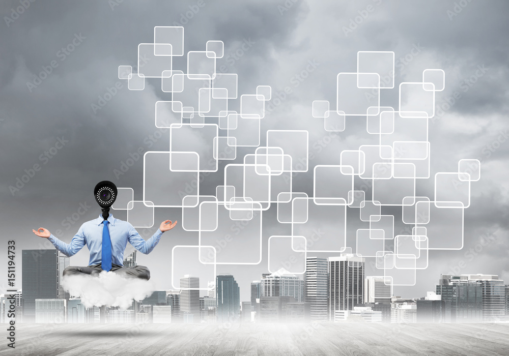 Camera headed man sitting in lotus pose on cloud against modern cityscape