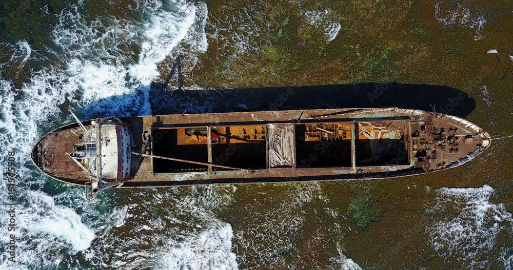  Beautiful seascape with old big, broken, rusty boat near the coast of Peyia, Cyprus. Ship graveyard