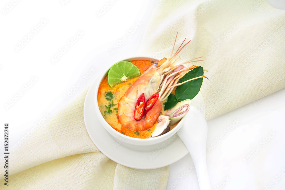 Close up Asian Spicy soup with shrimp in white bowl , famous Thai food cuisine calling Tom Yum Kung