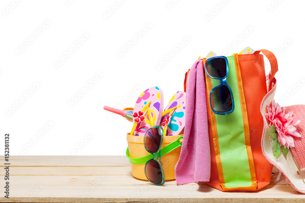 Beach accessory,hat,sunglasses,shoes,umbrella on wooden, concept summer holiday background and summe