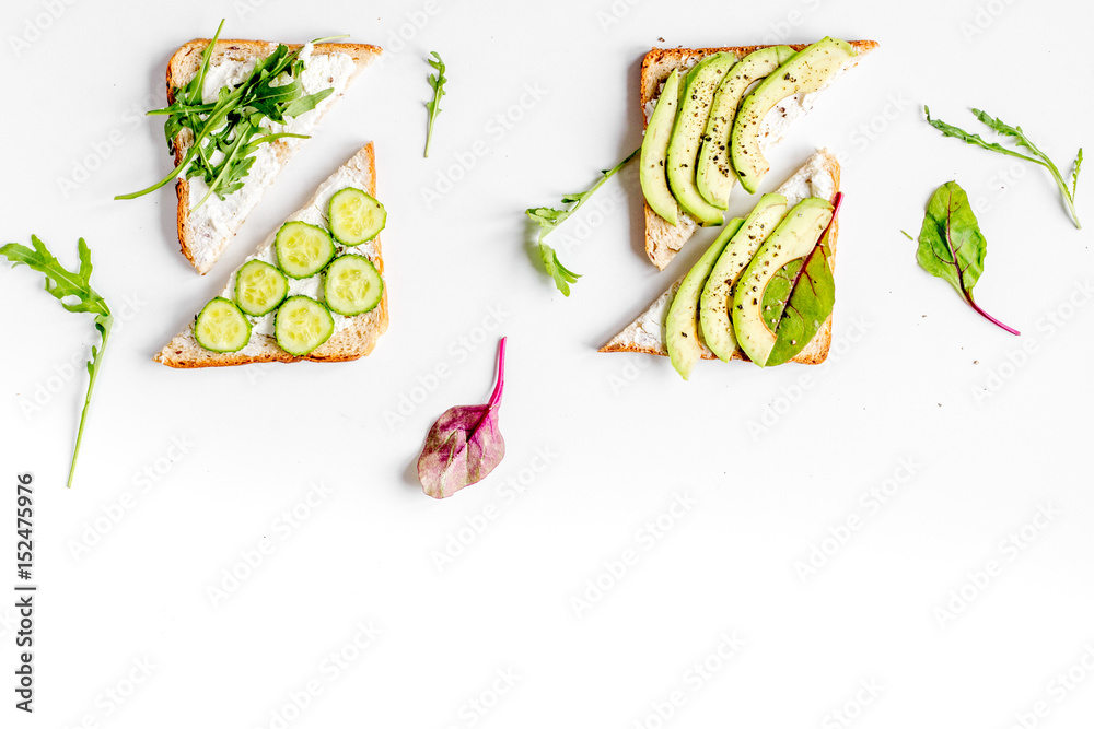 sandwiches set on white table background top view space for text