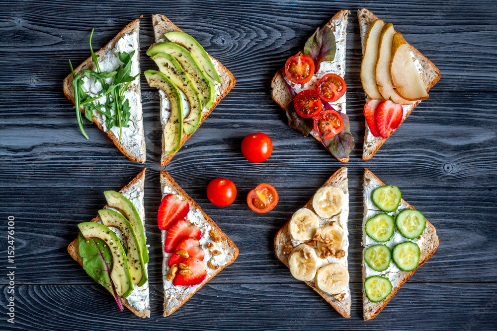 fitness breskfast with homemade sandwiches dark table background top view