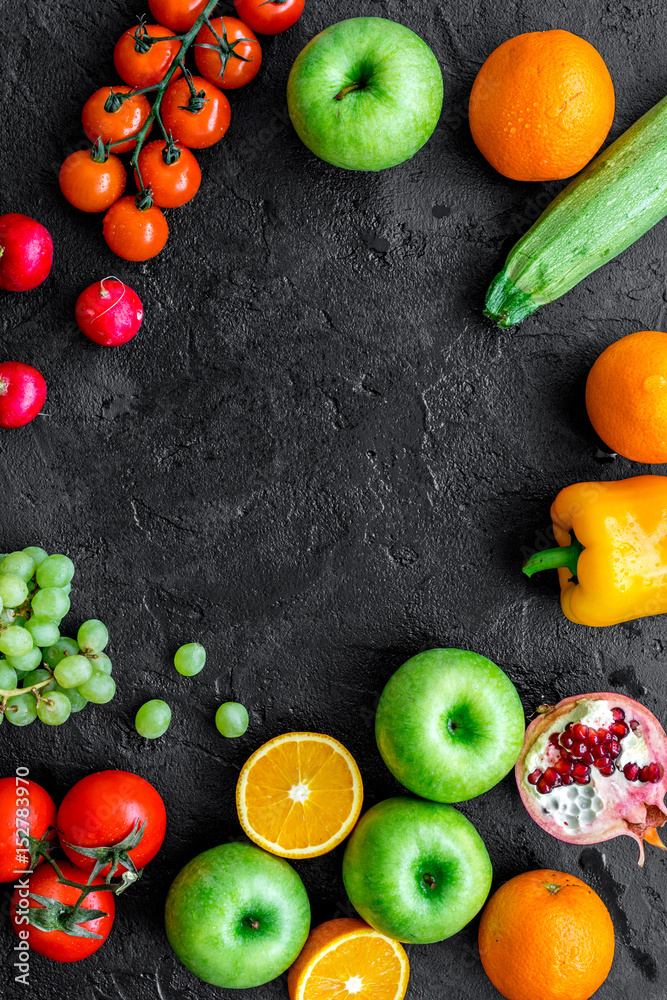 cooking salad with fresh fruits and vegetables on dark background top view mock-up