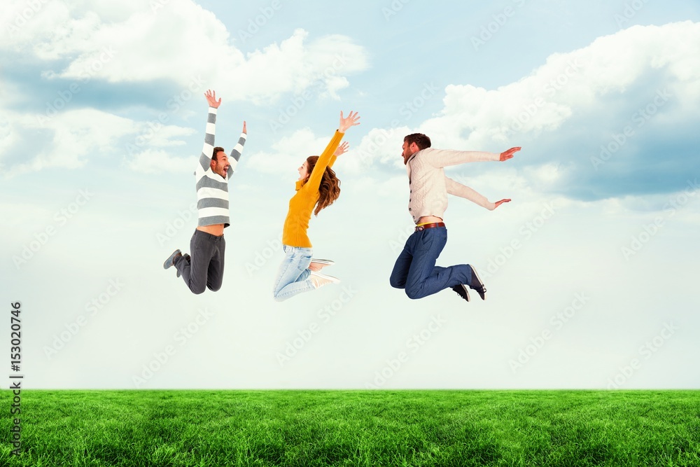 Composite image of friends jumping against white background