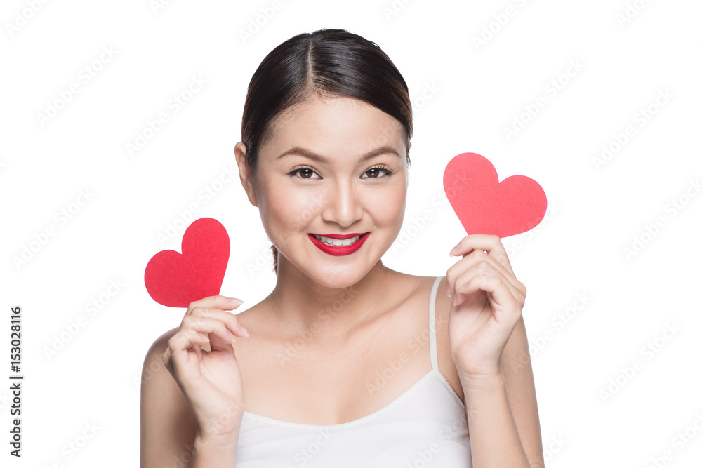 Attractive young asian woman holding red heart. Valentines day art portrait. Perfect make up