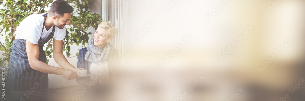 Waiter serving coffee to customer