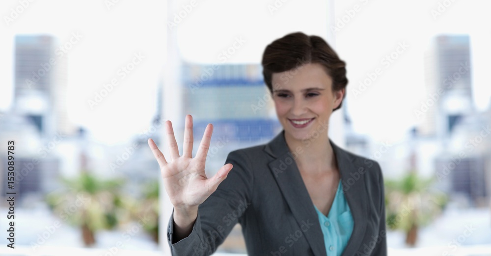 Happy businesswoman gesturing outdoors