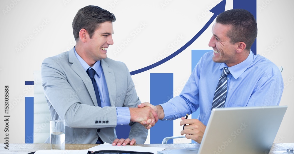 Business people shaking hands against graph