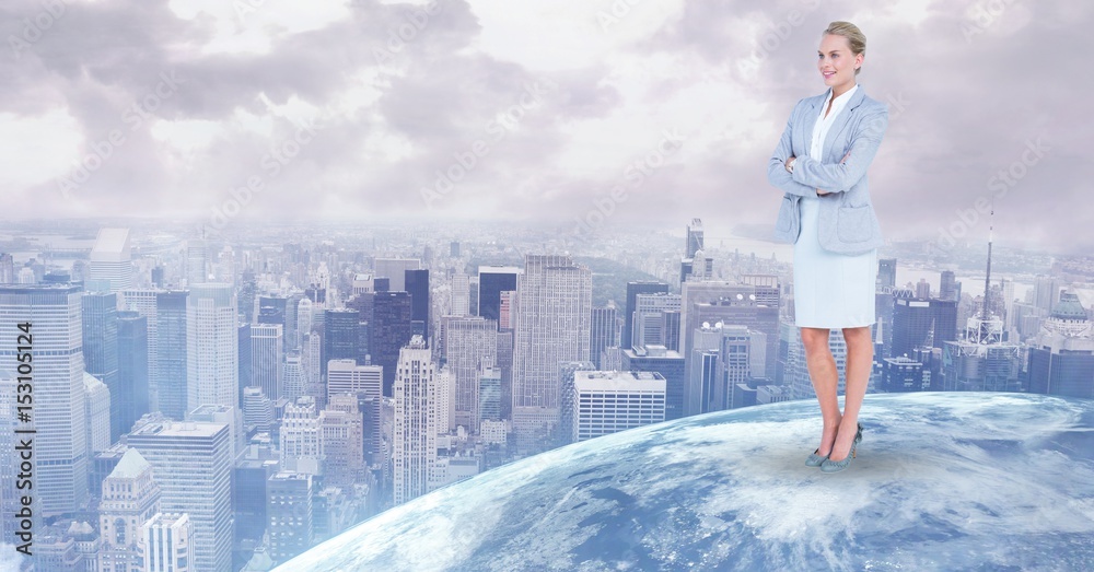 Businesswoman standing on globe against city