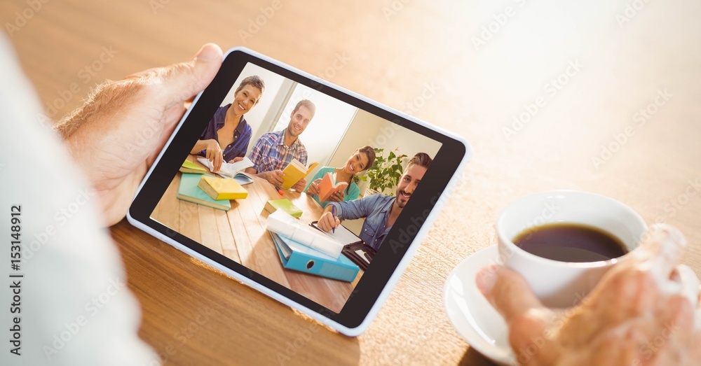 Hand video conferencing with team on tablet PC