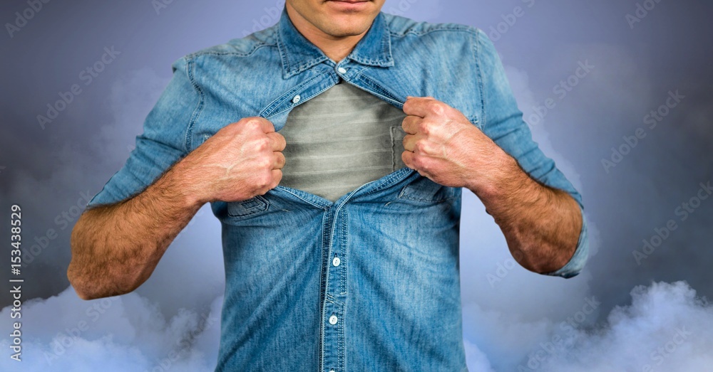 Midsection of man tearing shirt