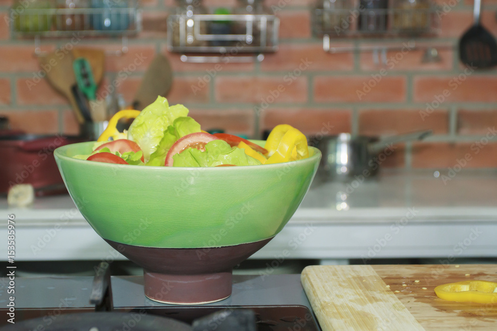 Vegetable salad in bowl in kitchen