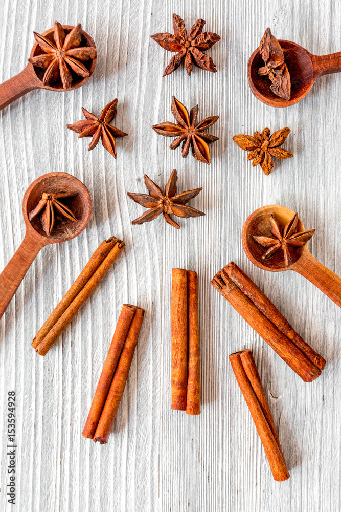 Flat lay vanilla, cinnamon, herb and spices on rustic kitchen background