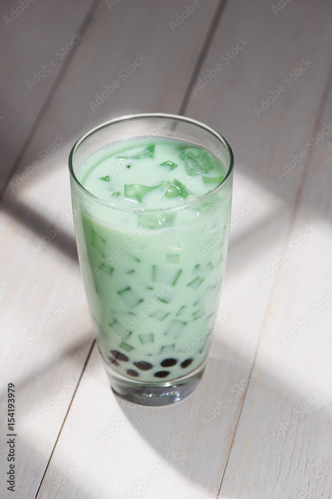 Boba / Bubble tea. Homemade Milk Tea with Pearls on wooden table.