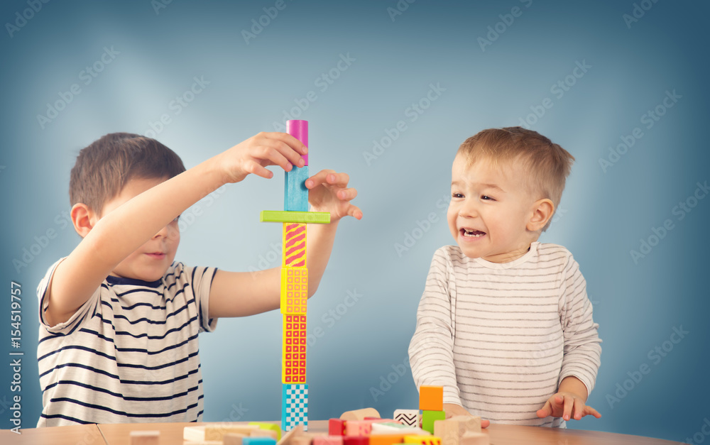 Portrait of a two years old child sitting at the table