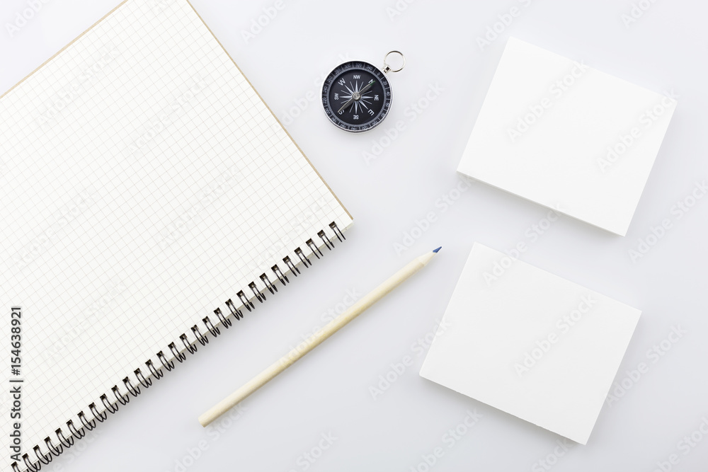 compass with blank white business paper,pencil on white background,Business direction concept.