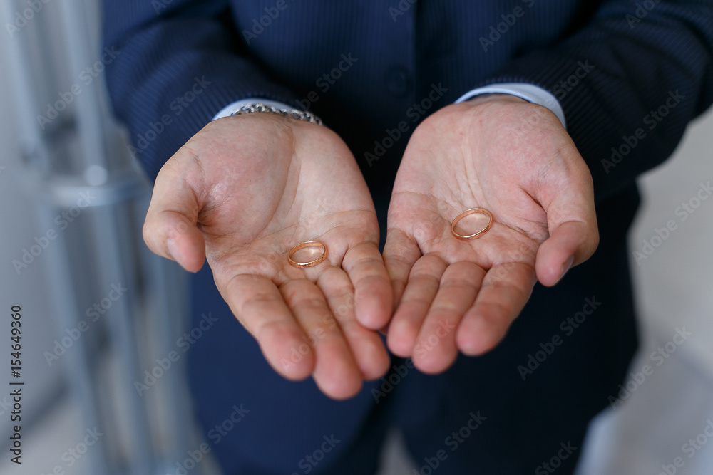 Two wedding rings on a hands of the groom