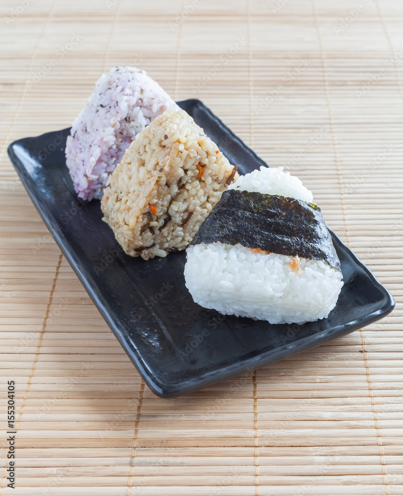 Onigiri , Japanese food rice ball made from white rice formed into triangular or cylindrical shapes.