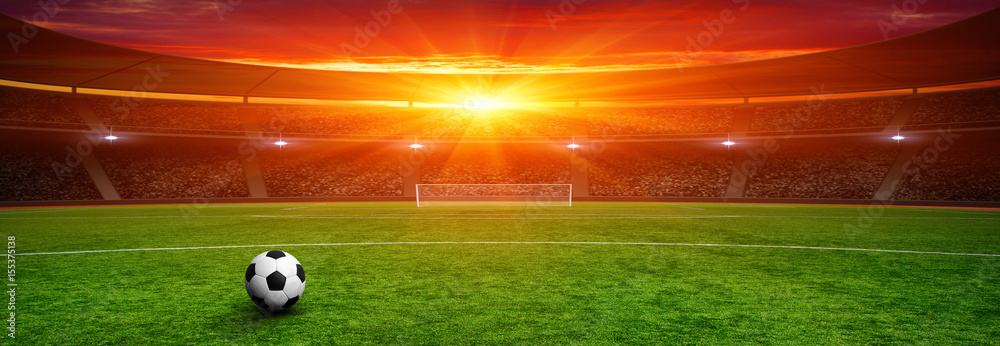 Soccer ball on green stadium