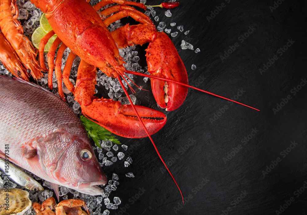 Many kind of seafood, served on crushed ice and black slate