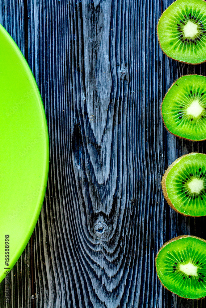 fresh green fruits with kiwi on wooden background top view mock-up