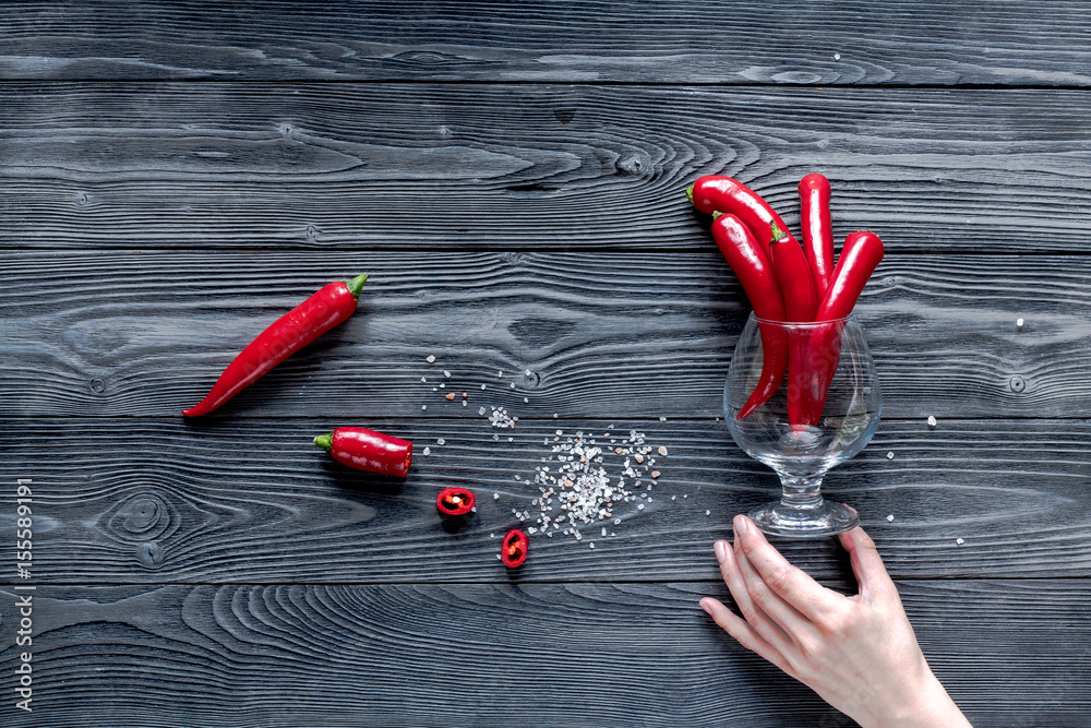 red chili pepper frame design on dark table background top view mock-up