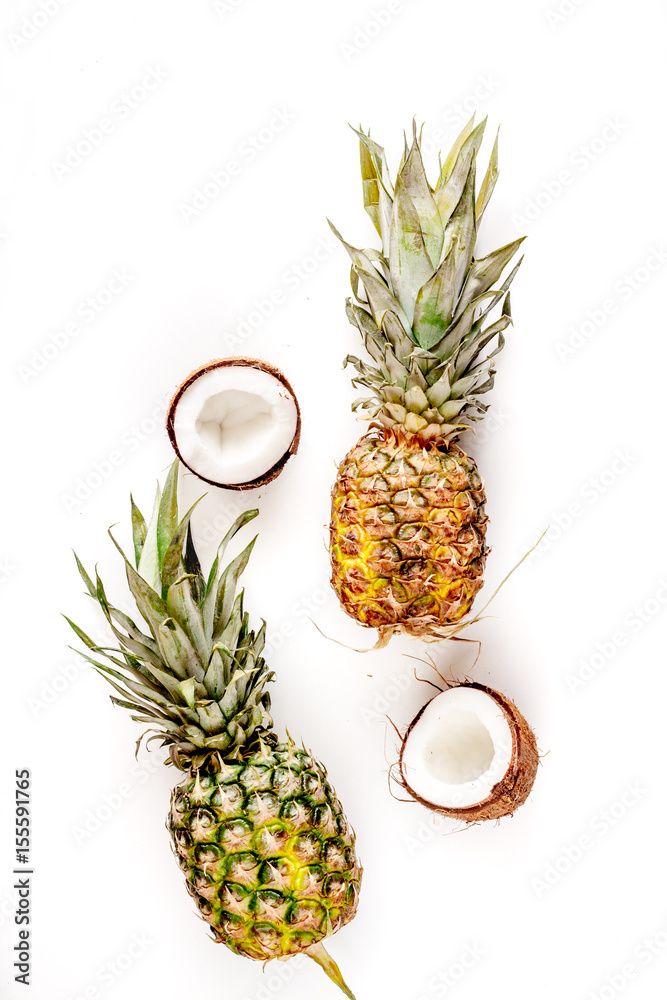 summer dessert with pineapples and coconut on white background top view