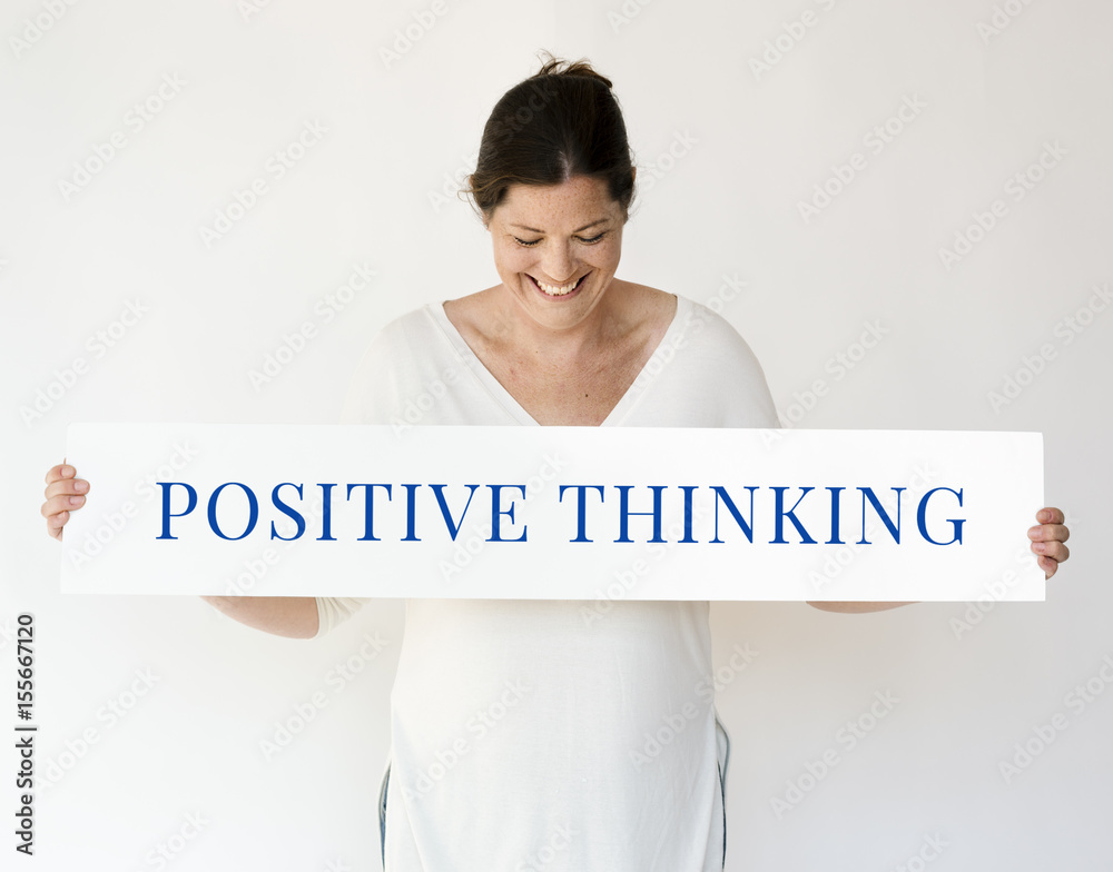 People holding and showing the positive thinking word