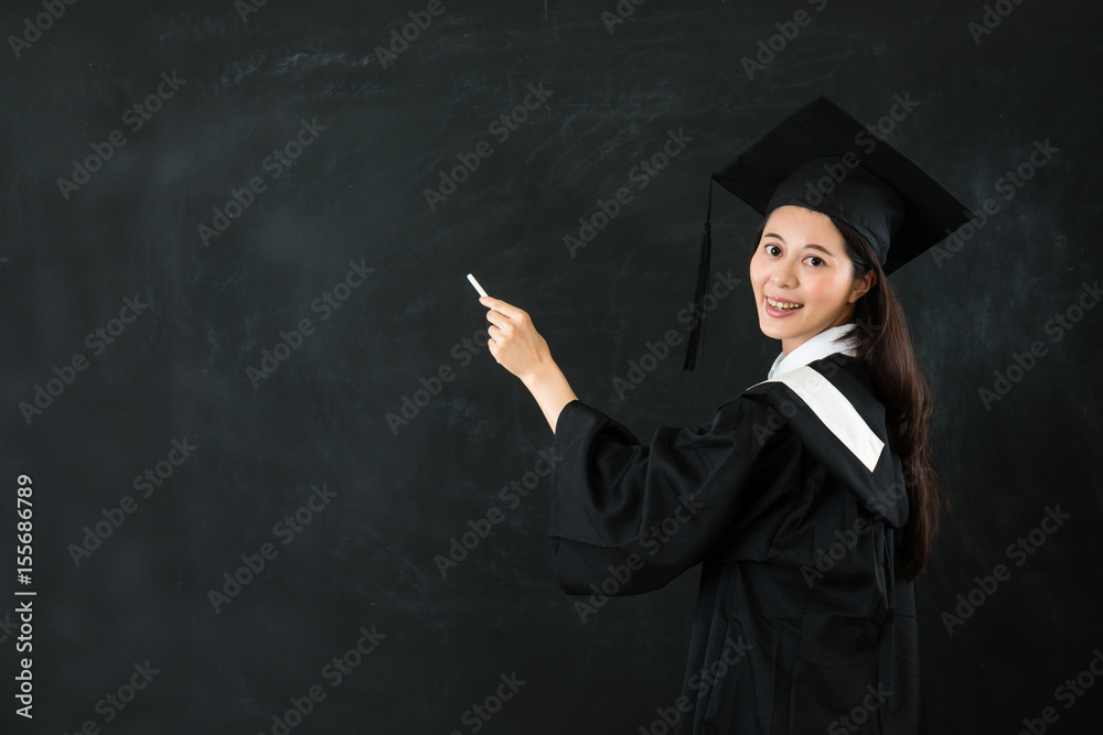 happy female student holding chalk