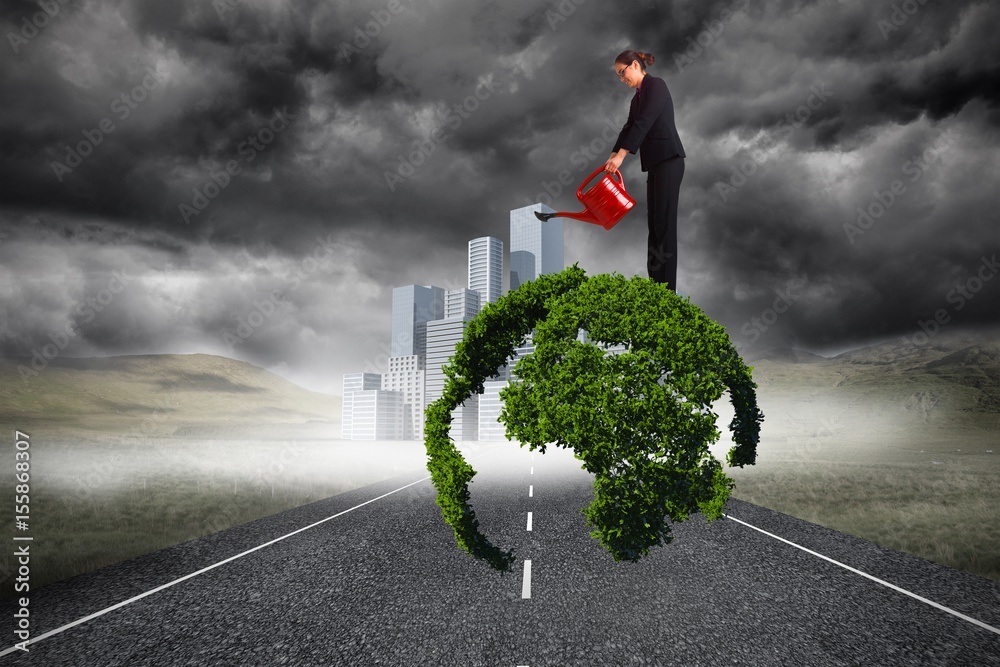 Composite image of businesswoman using red watering can