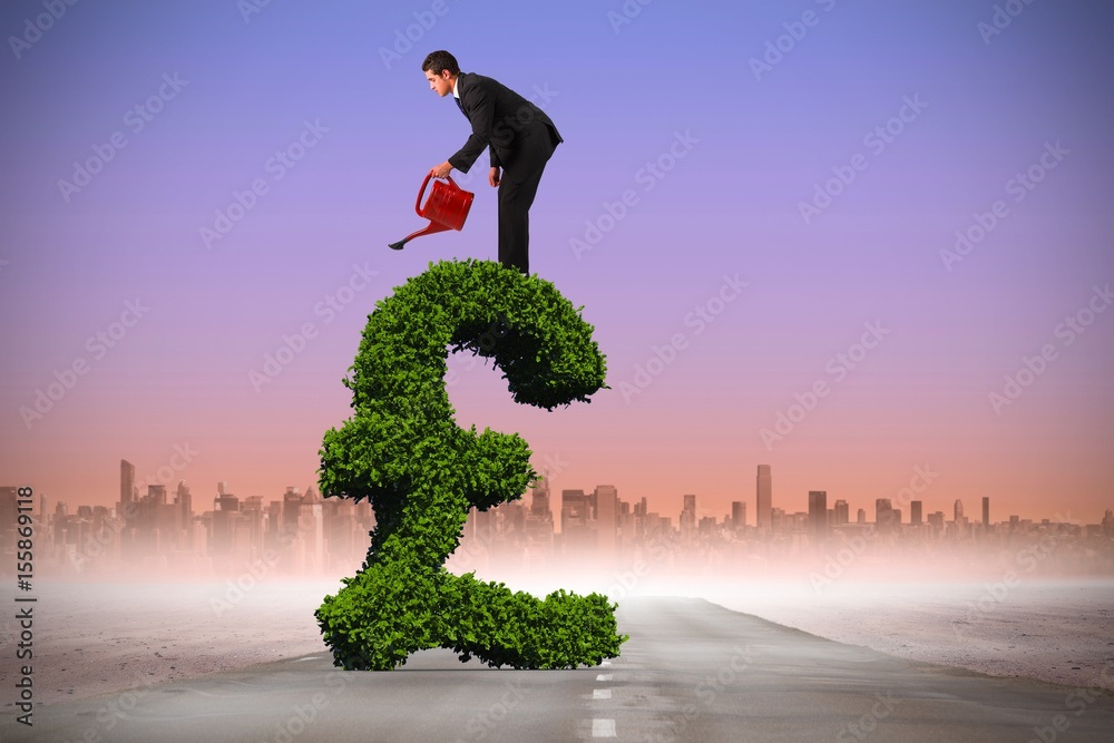 Composite image of businessman watering with red can